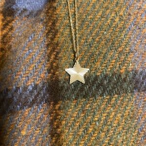14 K Solid Gold Star Pendant on a solid 14 K gold adjustable chain.